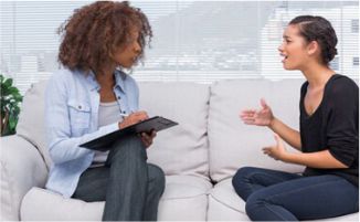 image of a psychologist listening to a patient