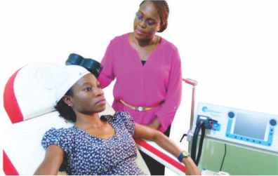 image of a patient undergoing an rTMS therapy by a doctor